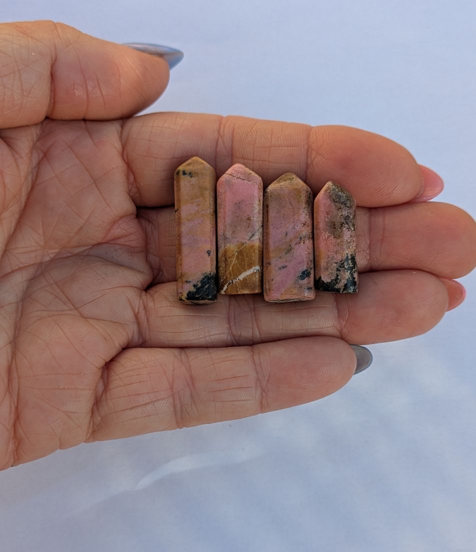 Mini Rhodonite polished obelisks showing pink rose coloration with black manganese veining