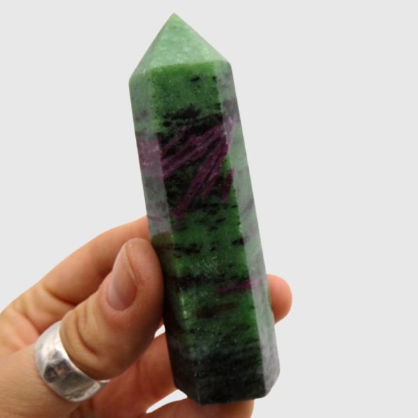 Ruby in Zoisite polished point crystal showing red ruby inclusions in green zoisite