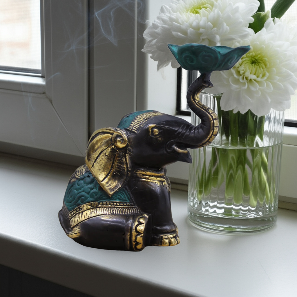 Elegant brass elephant incense burner with traditional Indonesian craftsmanship, suitable for incense cones and small candles